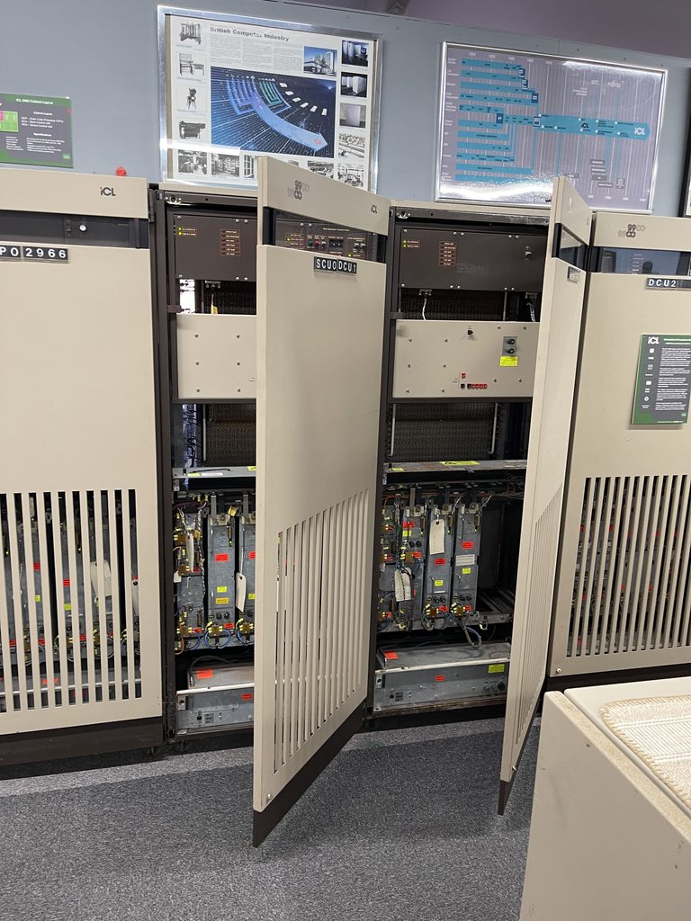 Mainframe cabinets standing open to show their circuit boards