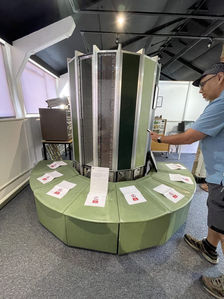 A stack of hard disk platters displayed on a plinth